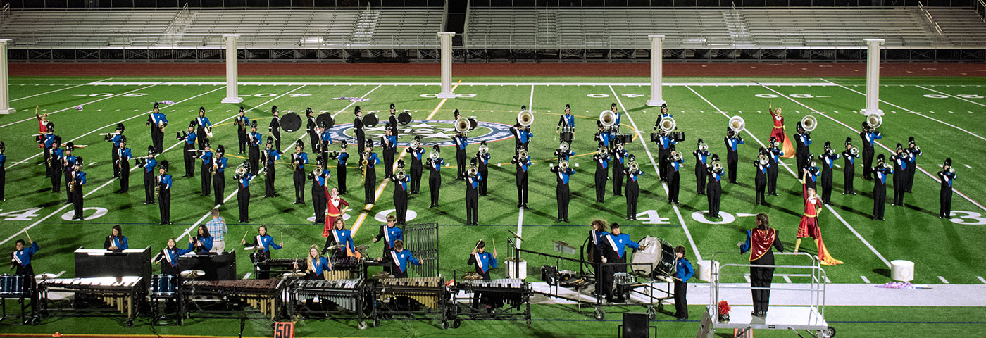 The marching band performing at a competition.